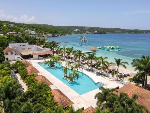 Sunset at ArecaHomes Beach Access Pool and Water Park in Discovery Bay