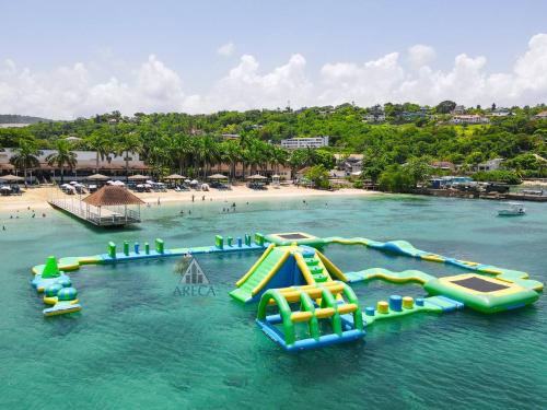 Sunset at ArecaHomes Beach Access Pool and Water Park in Discovery Bay
