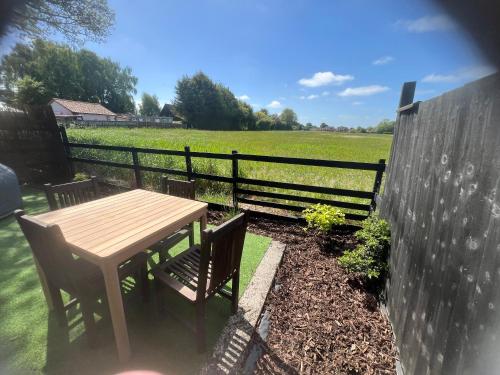 Lavender Lodge - Pool and Hot Tub with sunset views over open fields in Wicklewood