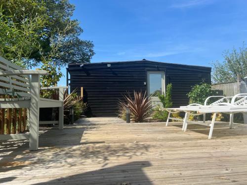 Lavender Lodge - Pool and Hot Tub with sunset views over open fields in Wicklewood