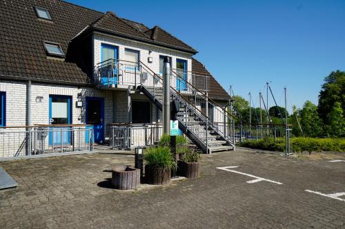 入口, Moderne Ferienwohnung N°9 Stexwig mit Panorama Schleiblick in 費爾多夫