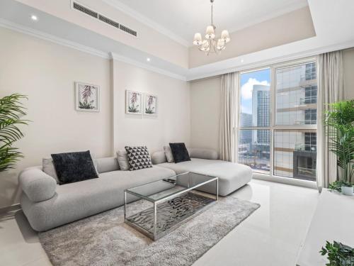 Urban Chic- Stylish 1BR Stay in Dunya Tower, Dubaj (fotografie 3)