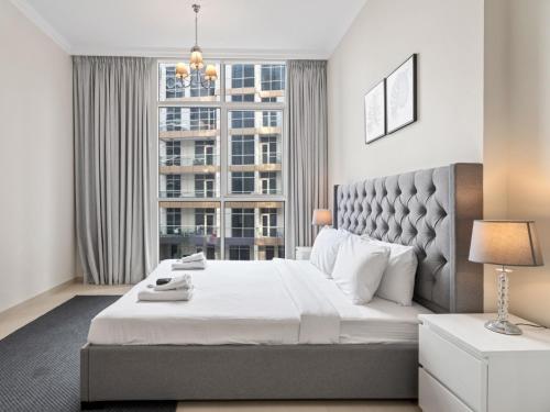 Urban Chic- Stylish 1BR Stay in Dunya Tower, Dubaj (fotografie 7)