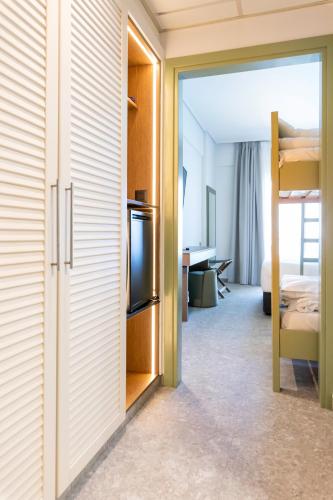 Quadruple Room (2 Adults + 2 Children) with Sea View image 5