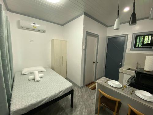 8-Door Room Apartment with Kitchenette and Air-Conditioned Individual Room in Tigatto