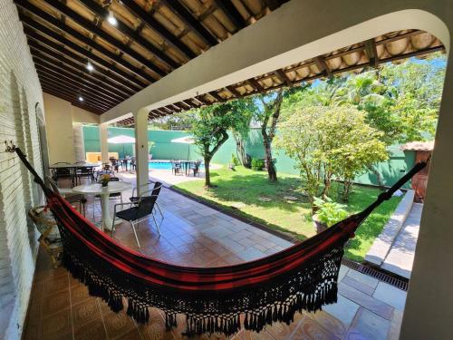 Refúgio Familiar com Piscina, Wifi, Jardim e Churrasqueira a 500 metros da Enseada (Refugio Familiar com Piscina, Wifi, Jardim e Churrasqueira a 500 metros da Enseada) in ชารดิง วีร์จิเนีย