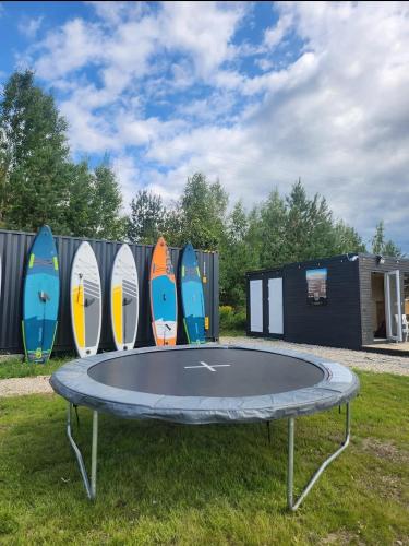 Natura Park Jurmala campsite with tent sites near a river in เจอร์มาลา