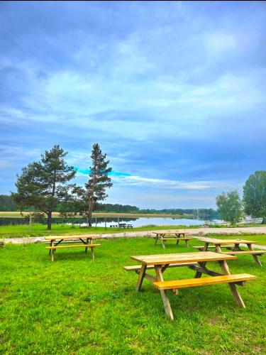 Natura Park Jurmala campsite with tent sites near a river in เจอร์มาลา