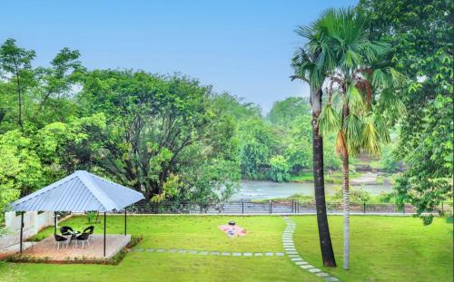 SaffronStays Nilaya by the River - 3BR riverside villa with private pool, bonfire, BBQ & river views, Dhamni