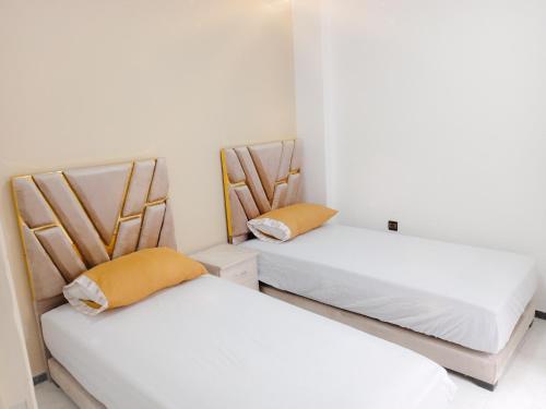 Three-Bedroom Apartment room in Appartement 3 chambres a coté Marjane