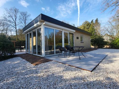 Kert, Boshuisje Seth sauna en whirlpool in Verspreide huizen Appelscha