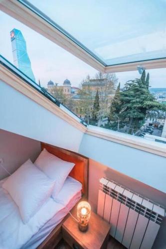 Rooftop Boutique Rooms on Rustaveli with Skylight Central Location - Tap to explore photos