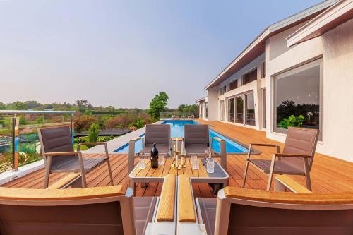 StayVista's Villa 107 at Canary Farms - Pure Veg with Huge Lawn, Pool and Home Theatre in Gold Valley