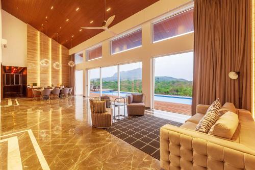StayVista's Villa 107 at Canary Farms - Pure Veg with Huge Lawn, Pool and Home Theatre in Gold Valley