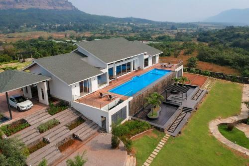 StayVista's Villa 107 at Canary Farms - Pure Veg with Huge Lawn, Pool and Home Theatre in Gold Valley