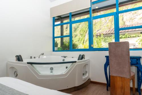 อ่างแช่น้ำร้อน, Hotel De Mi Pueblo in บาโนส