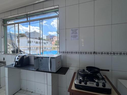 Kitnet no centro de Betim in เบทิง