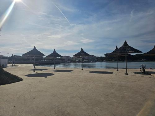 Betina apartments with parking space near the beach in Murter