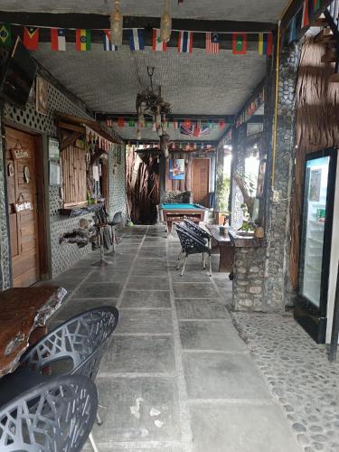 Shared lounge/TV area, Thousands of Bottles - Hostel and Trekking Agency Sumatra Orangutan Nature in Bukit Lawang
