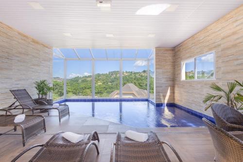 Swimming pool, Pousada Kaliman Campos do Jordao - Premium in Campos Do Jordao