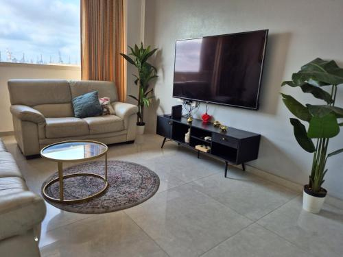 Skupni salon/TV območje, Lovely three-room apartment above the promenade in Ashdod