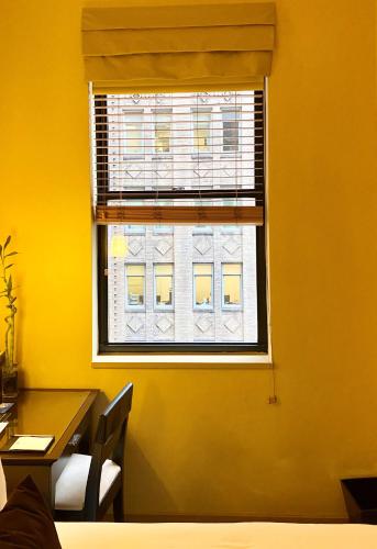 Petite Room with One Full Bed room in Library Hotel by Library Hotel Collection