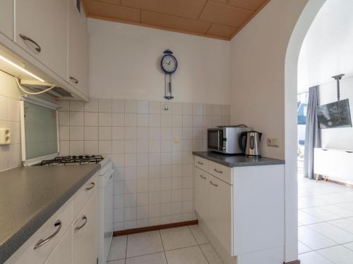 Kitchen, Holiday Home St Maartenszee near Beach in Schagen