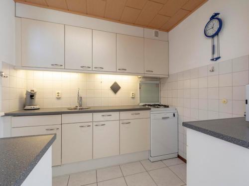 Kitchen, Holiday Home St Maartenszee near Beach in Schagen