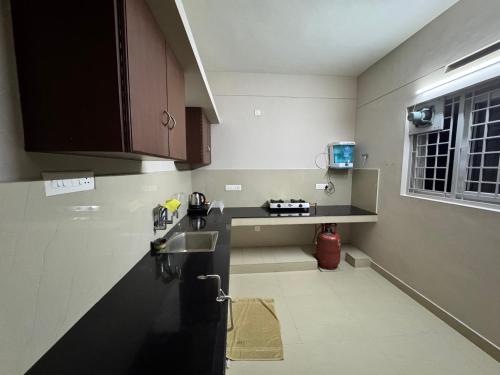 Kitchen, Nachiyar Suites in Thiruvananthapuram