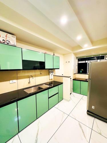 keuken, m² 2 slaapkamer, 2 privé badkamer Vrijstaande woning in Puduppadi (DEEVS Appartments landmark village ) in Puduppadi