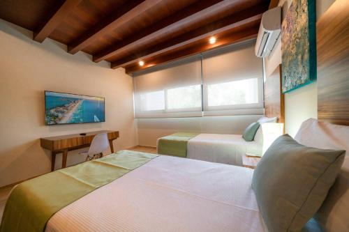 Luxury 2 Bedroom Condo - Infinity Pool at AWA Residences in Playacar, AWA 107 in Playa del Carmen, Mexico