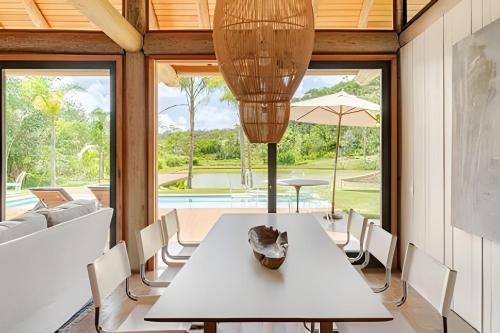 Secreto Cocheira | Piscina, jacuzzi e lago privativo @secretobangalos in 帕迪杜阿爾菲雷斯