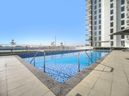 Swimming pool, Silkhaus Canalside Studio in Water's Edge Tower in Yas Island