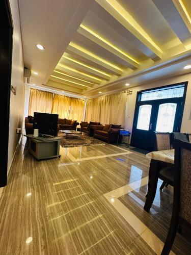 Shared lounge/TV area, The Green Haven in Khatt