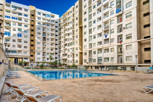 Bel appartement piscine,10 min souk, plage, bein sport in Al Mohammadi