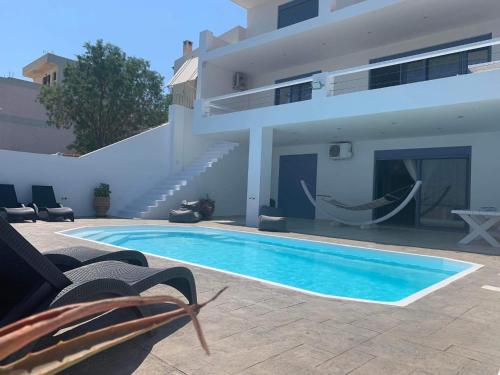 Exterior view of NV seafront Villa with private pool & NV seafront luxury suites no pool acces - Aegina