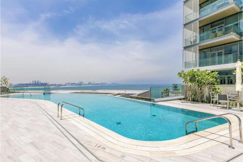 Swimming pool, Livbnb - Upgraded 2BR, Near Shopping & Dining Hubs in Bluewaters Island