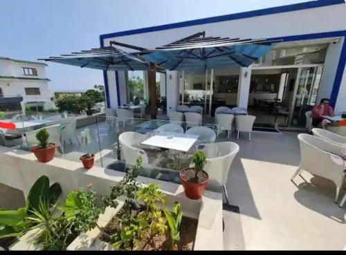 ห้องอาหาร, Grand appartement avec piscines in คาโบเนโกร