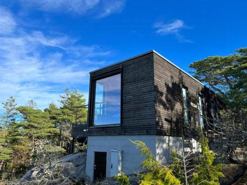 Vista exterior, Live Among Trees In An Architect Drawn Cabin in Skjaerhalden