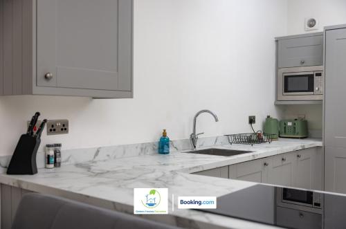 Kitchen, 2 Bedroom Apartment By Green Haven Escapes Short Lets & Serviced Accommodation In Leeds with Free Wi in Far Royds