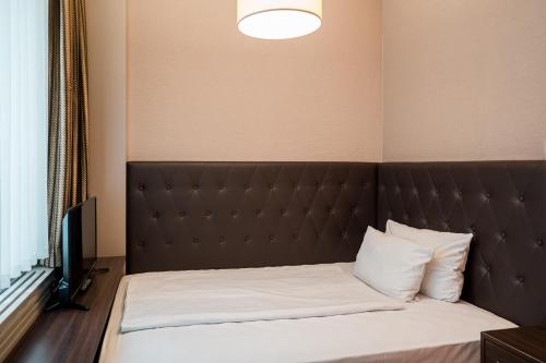 Homaris West Side - Self-Check In, Berlin (Foto 4)
