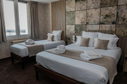 Chambre triple, vue sur la mer