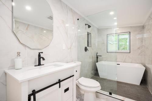 Shower, Chic 3BR Bungalow with Screened Porch & Patios in Browns Mill Park