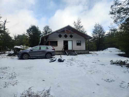 Cabaña en Conguillio nieve con vista al volcan y tinaja