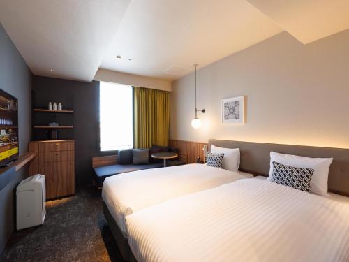Comfort Twin Room with Sofa Bed room in CROSS life Hakata Tenjin