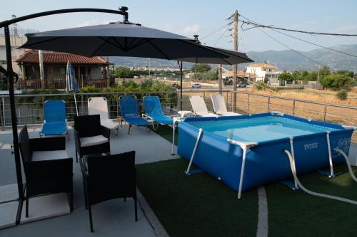 Red Harmony by the sea Pool and balcony in Mpournias