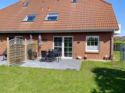 Nessmersiel, Renovierte Erdgeschosswohnung mit Garten, in Deichnähe, Wallbox,