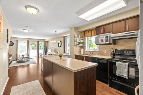 Kitchen, SimplyLovely Modern Condo Near Downtown Ottawa with Free Parking and Patio in Alta Vista