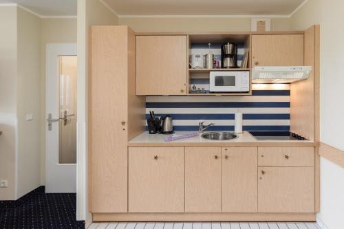 bucătărie, Seestern - Charmante 2-Zimmer-Wohnung mit Balkon in Zingst