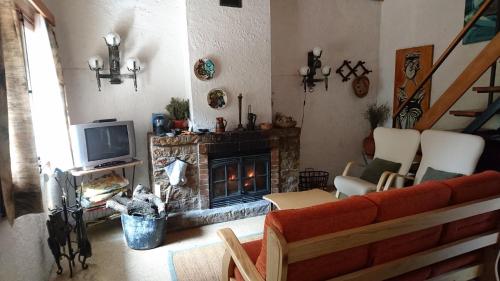 Koplietošanas atpūtas telpa ar TV, La Caseta del Port in Alfara de Carles